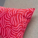 SANDMOTT Cushion, bright red/bright pink, 30x58 cm